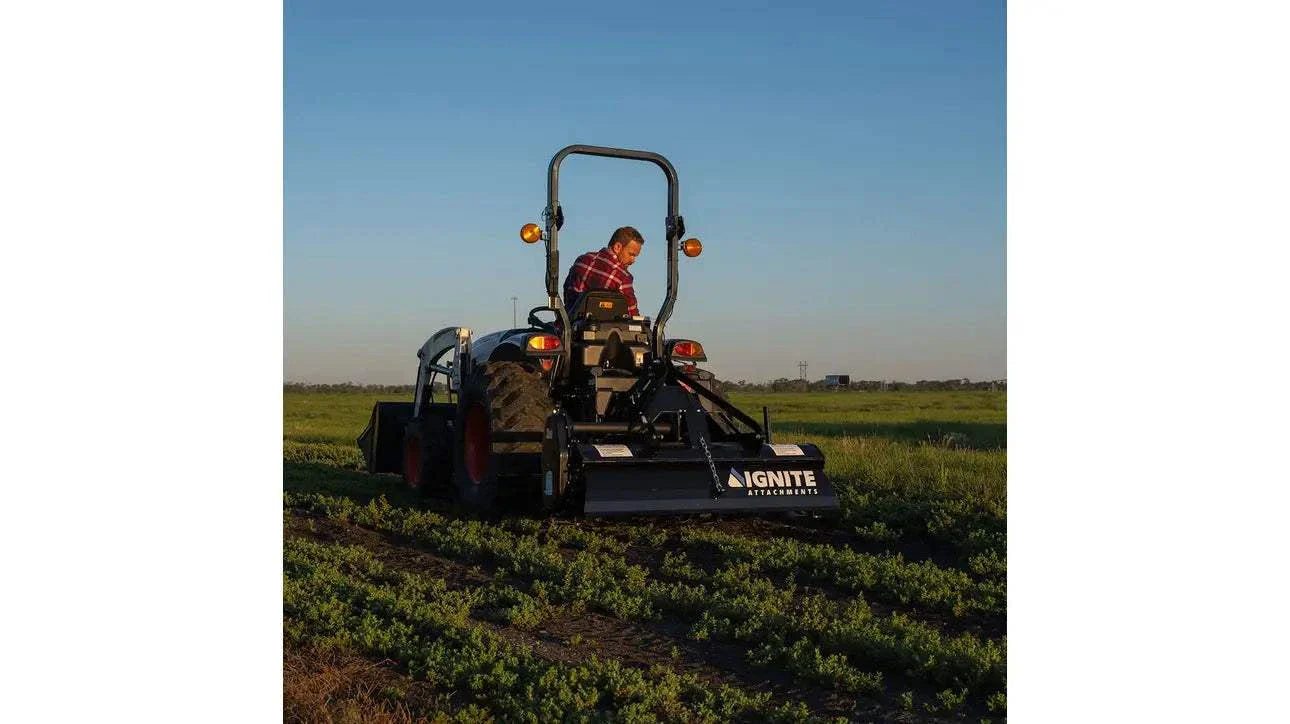 60 Inch 3-Point Tiller for Tractors in use for soil cultivation in the field.