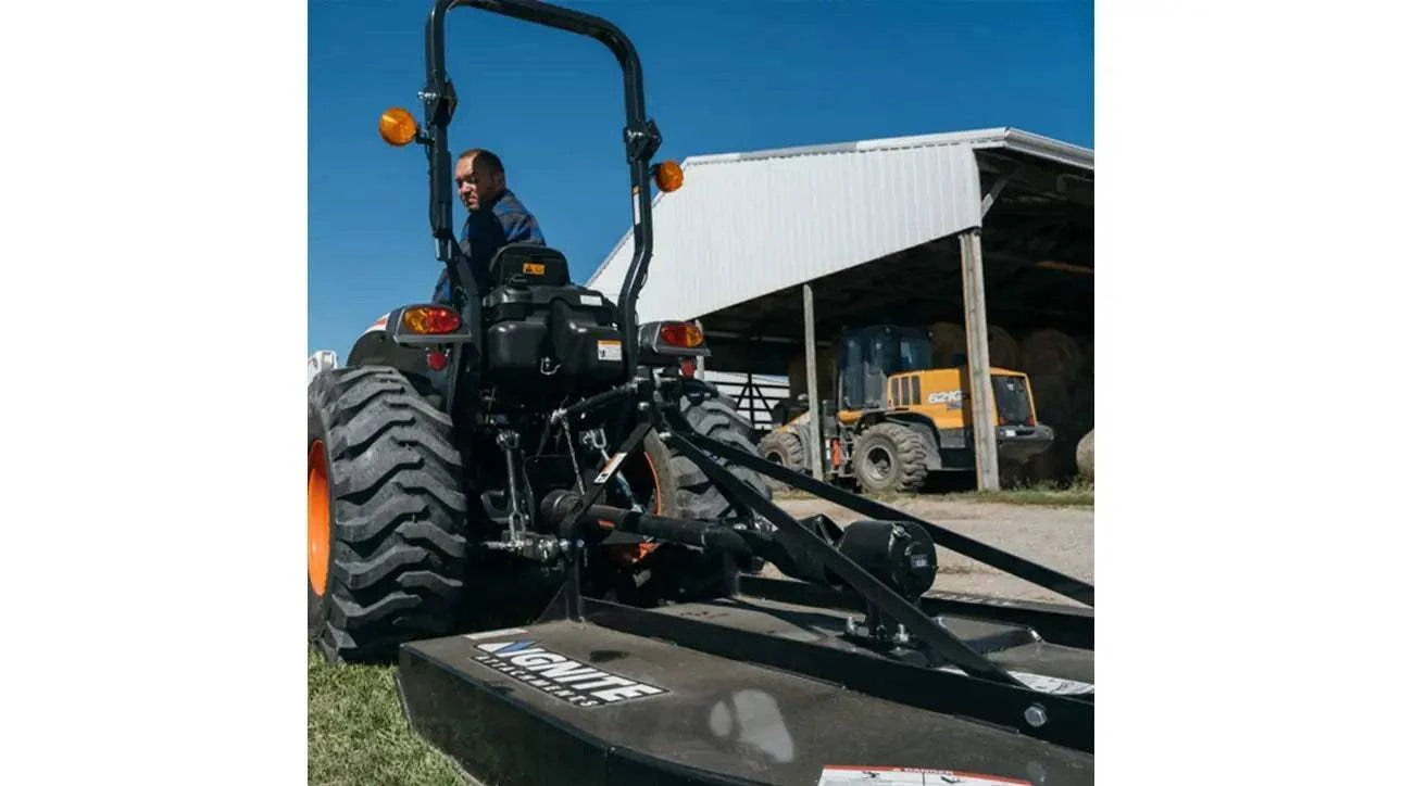 60-inch Ignite rotary cutter attached to a tractor, ideal for clearing pastures and managing large properties.