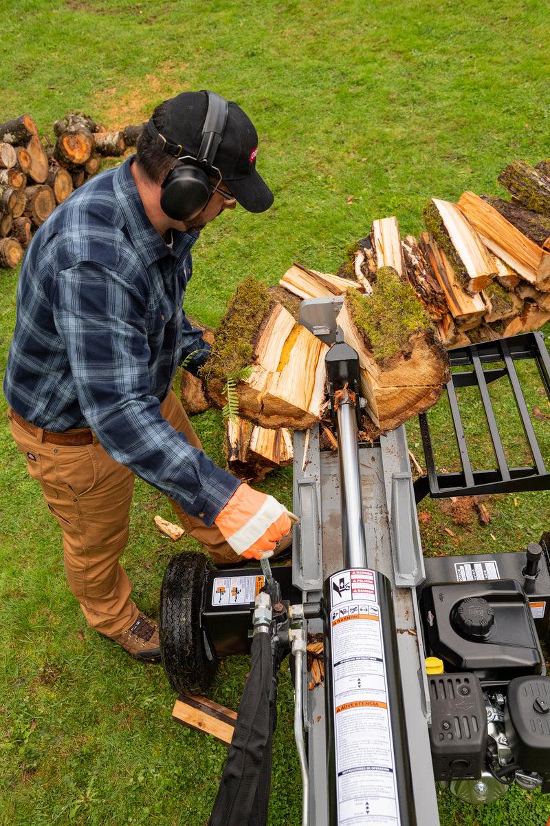 Oregon 30-Ton Gas Log Splitter being used for wood splitting on grass.