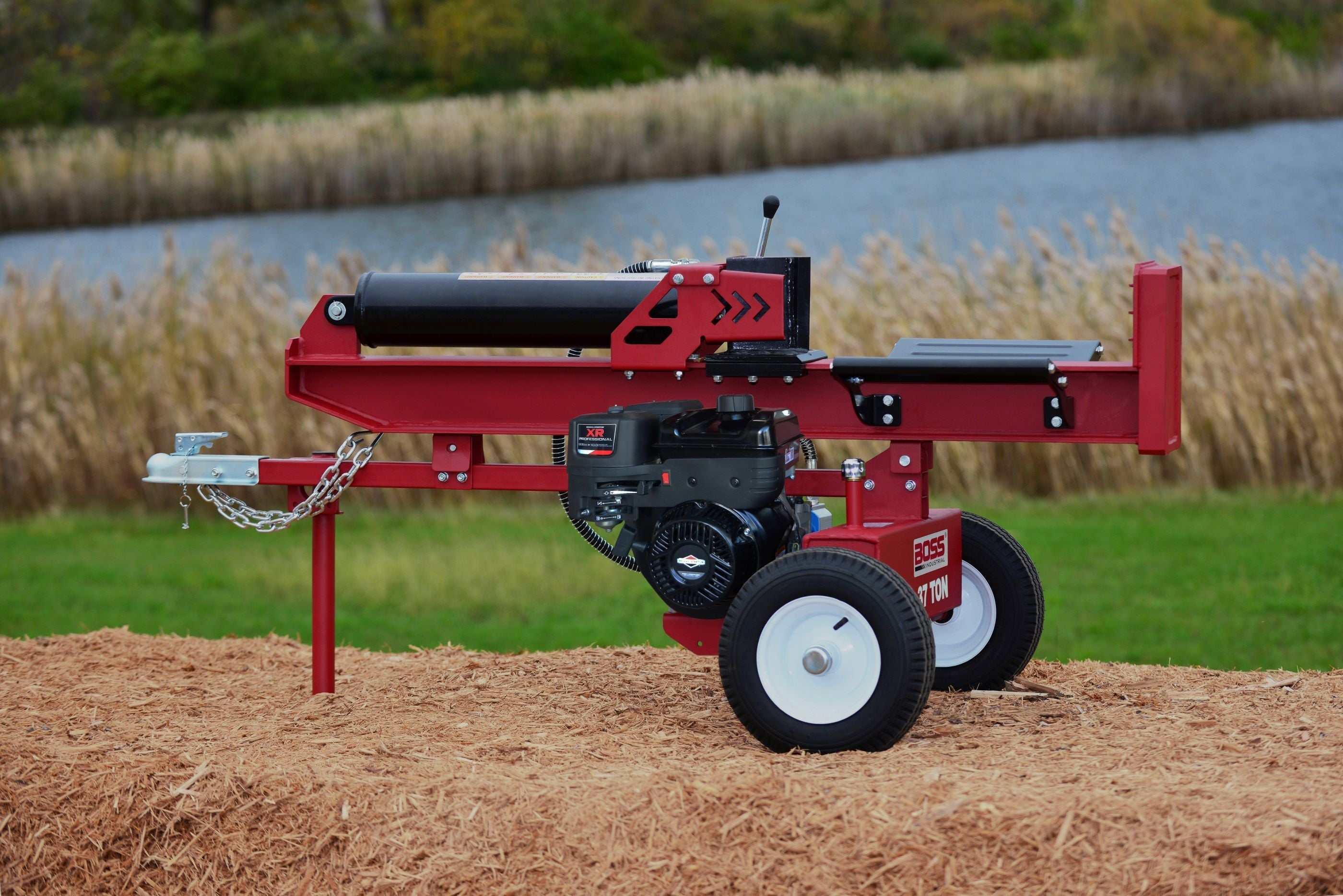 Boss Industrial 37-Ton Log Splitter with Briggs & Stratton engine, showcasing horizontal/vertical operation in an outdoor setting.